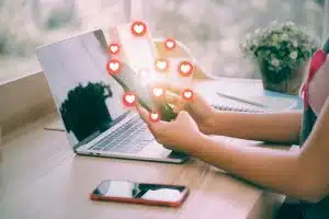 Woman's Hand Using A Smartphone To A Dating App. There Is A Hear