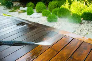 cleaning terrace with a power washer - high water pressure clean