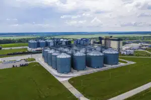 New factory in field. View from above. Ecological production. Bio gas plant. Sustainable production.