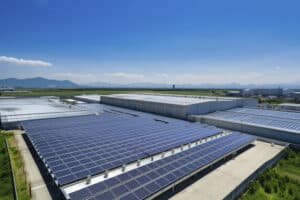 Solar panels on factory.Architectural detail of metal roofing on commercial construction Solar panels or Solar cells on factory rooftop or terrace with sun light, Industry.